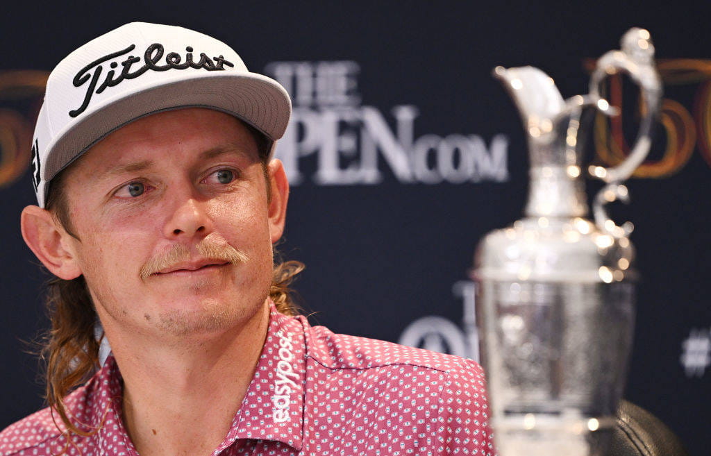 Cameron Smith admires trophy
